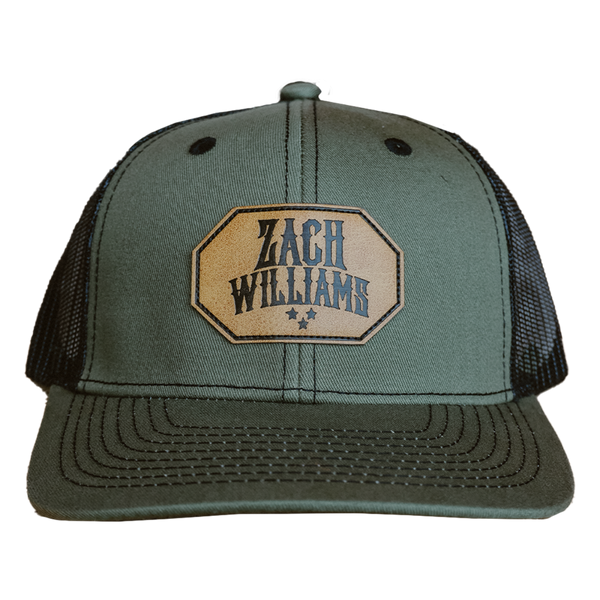 Olive green trucker hat with a ’Zach Williams’ patch on the front.