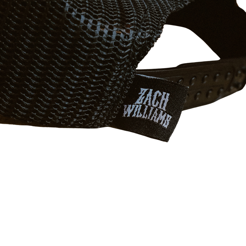 Black baseball cap with a ’Zach Williams’ label visible.