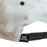 White baseball-style cap with a ’Zach Williams’ branded adjustable strap.