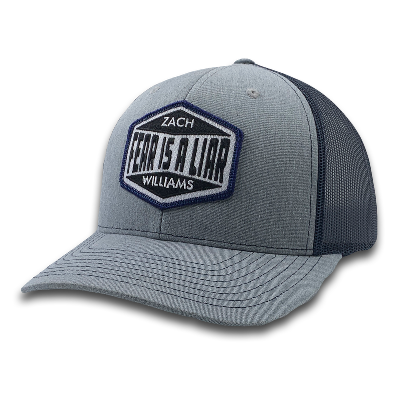 Baseball-style cap with a logo patch reading ’Zach Williams Fear Is A Liar’.
