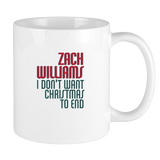 White ceramic mug with red and green text referencing Zach Williams and Christmas.