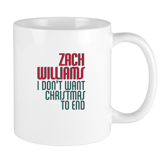 White ceramic mug with red and green text referencing Zach Williams and Christmas.