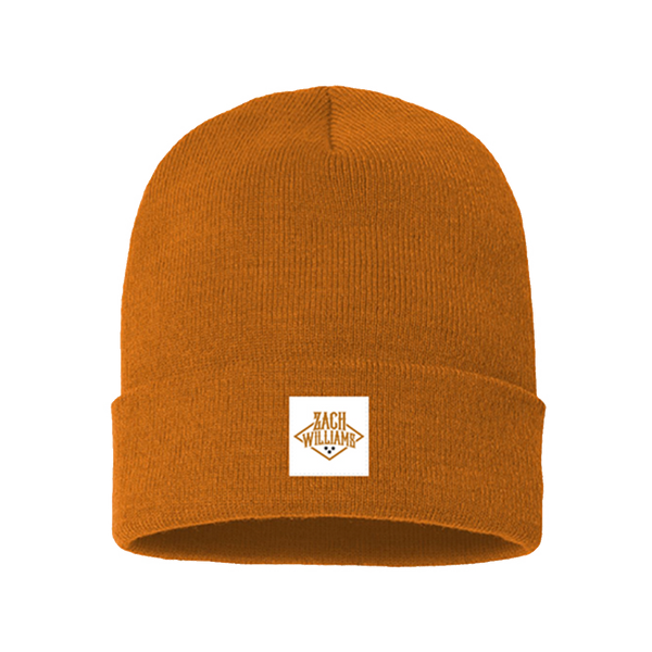 Orange knit beanie with a white square patch on the front.